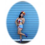 Competitive eater, Mary Bowers accessorizes both food and fashion as a patriotic hotdog pinup